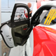 A door with cut-outs in the carbon fiber for a roll cage means business. Also, spot the face.